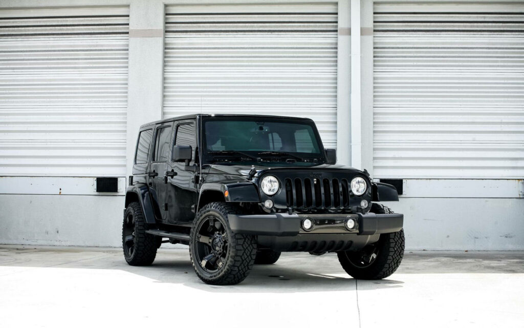 Rugged Elegance On Wheels: A Striking Black Jeep, the Symbol of Off-Road Superiority Wallpaper