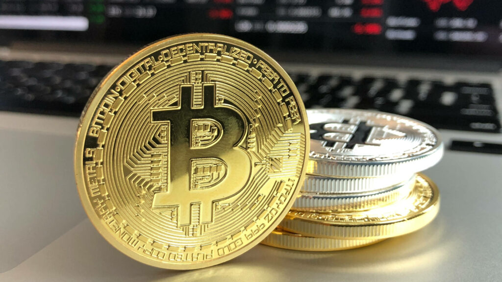 Currency of the Digital Age: Forex Background featuring a Stack of Precious Golden and Silver Bitcoins Wallpaper