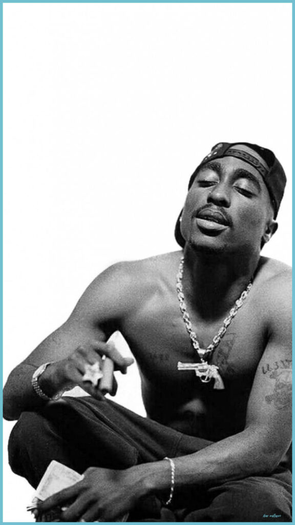 The Captivating Essence of Tupac Shakur: A Visual Testament to the Enduring Impact and Empowering Aura of his Performance Wallpaper