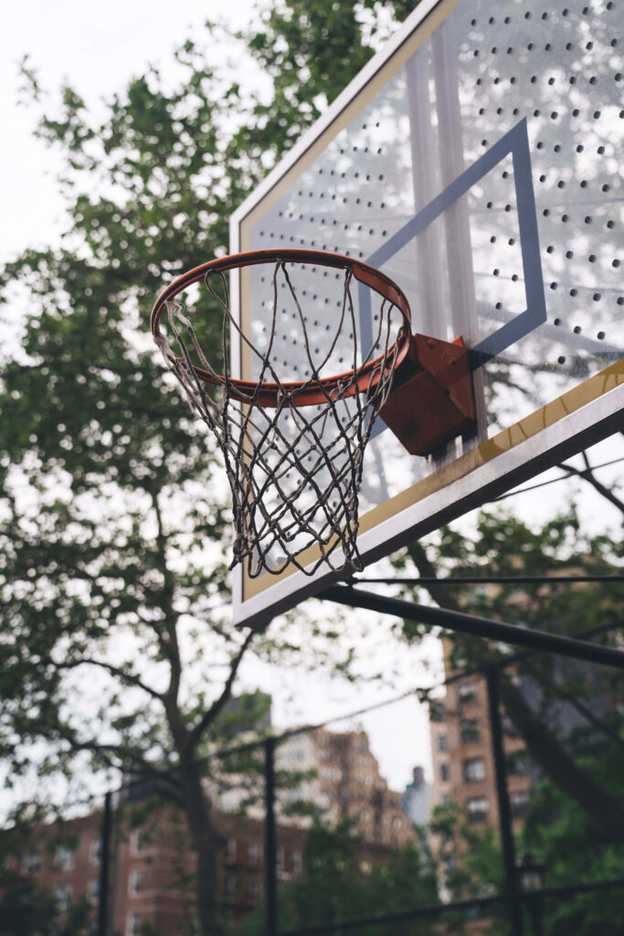 Urban Basketball Hoop Wallpaper: Sports Meets City Culture