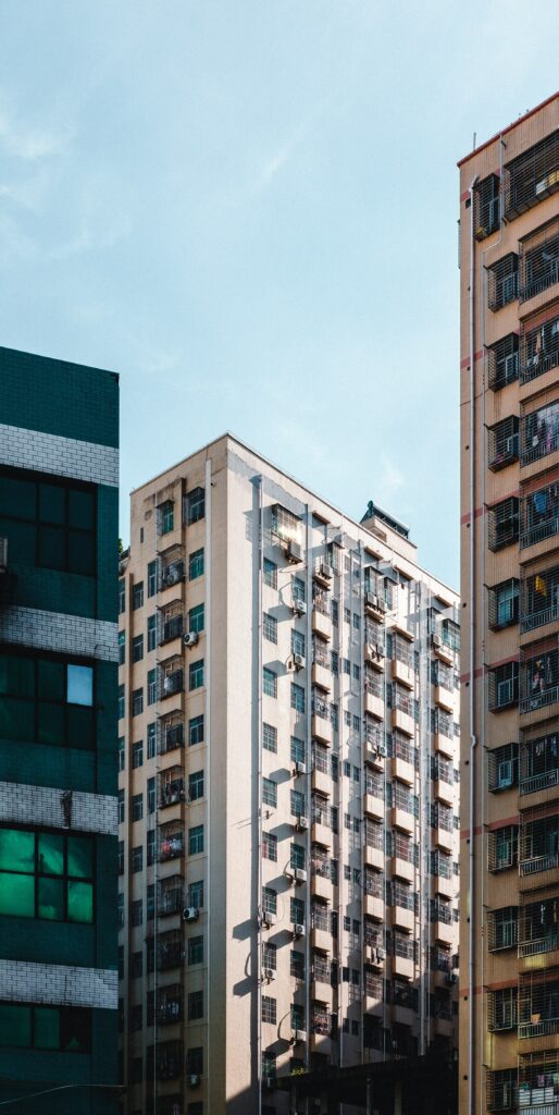 Modern Cityscape Wallpaper: Stunning Urban Architecture Under Blue Sky