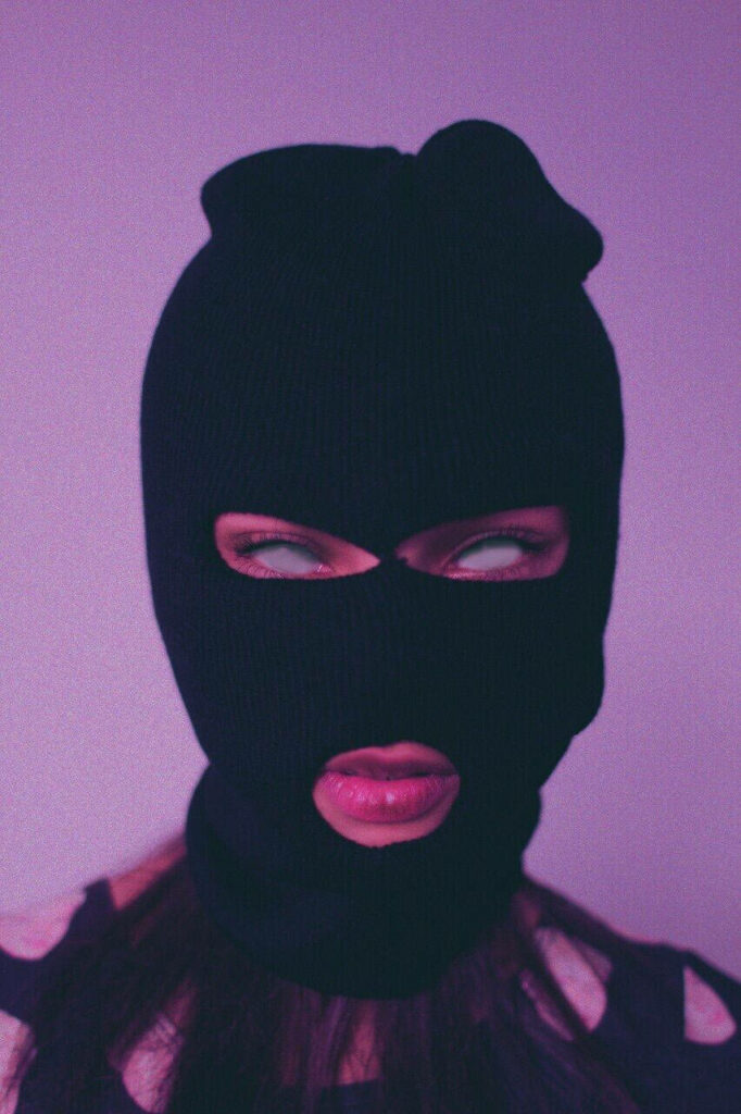 Pink Power: A Stylish iPhone Baddie Rocking a Black Ski-mask Wallpaper