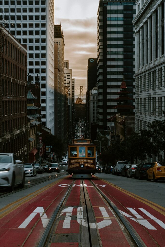 Vibrant City Life Wallpaper with Tram and Towering Buildings