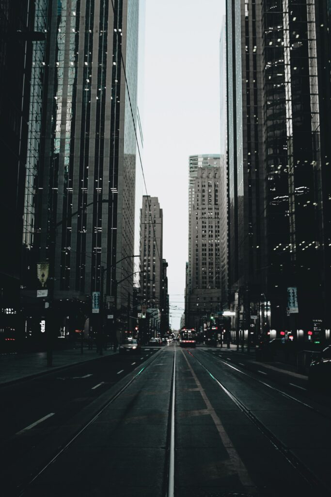 Urban Cityscape Wallpaper: Tram Rails & Reflective Buildings