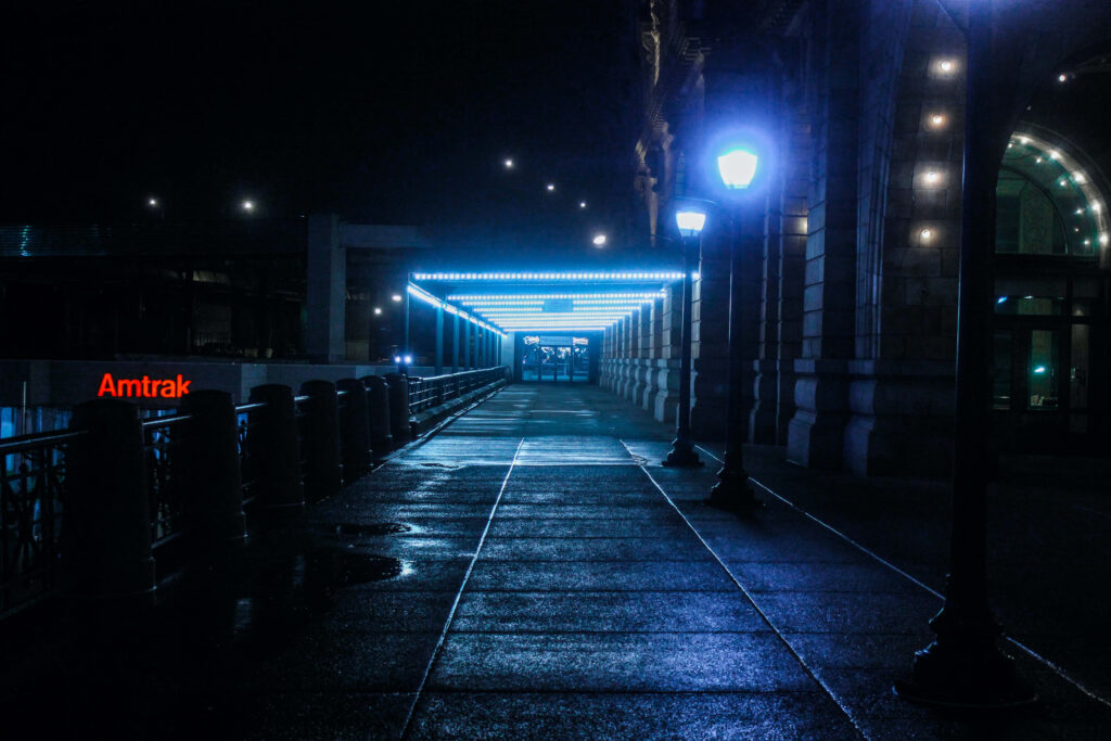 Serene Urban Night Scene: Glowing Blue Light Wallpaper