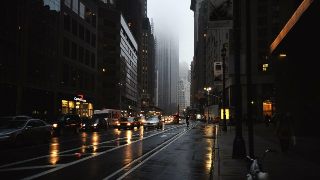 Urban Noir: Glistening Streets and Shadows of a Metropolis Wallpaper