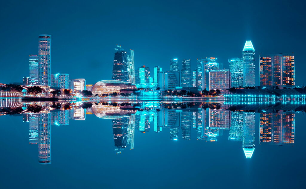 Enchanting Urban Nightscape: A Breathtaking HD Wallpaper of a Beautifully Reflective City Skyline