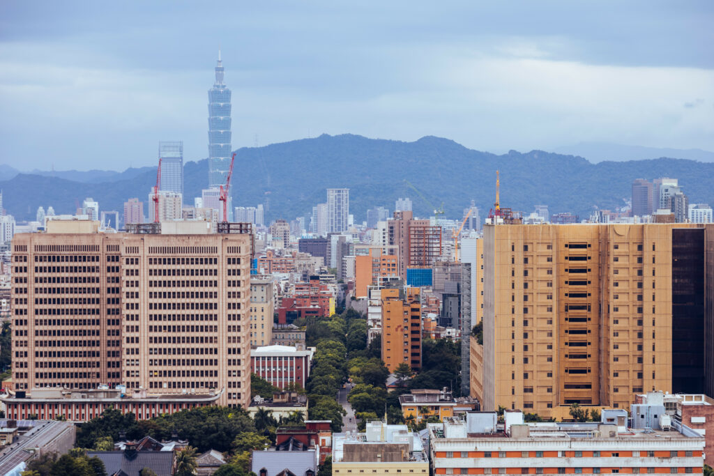 Urban Skyline Wallpaper: Modern Architecture & Lush Green Trees