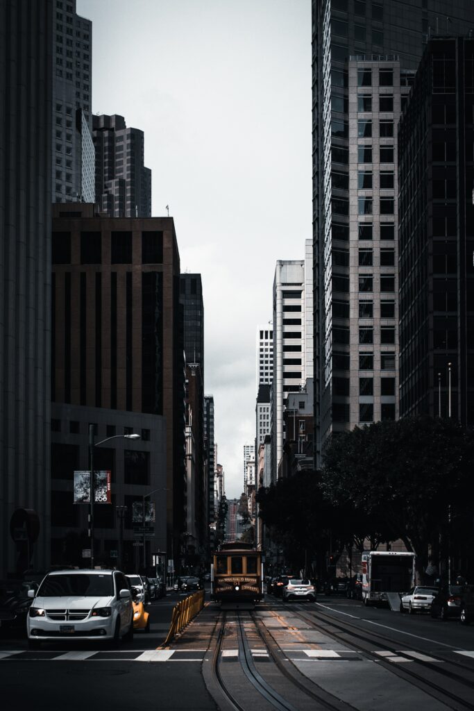 Dynamic Urban Street Wallpaper: Tram Rails & City Life Energy