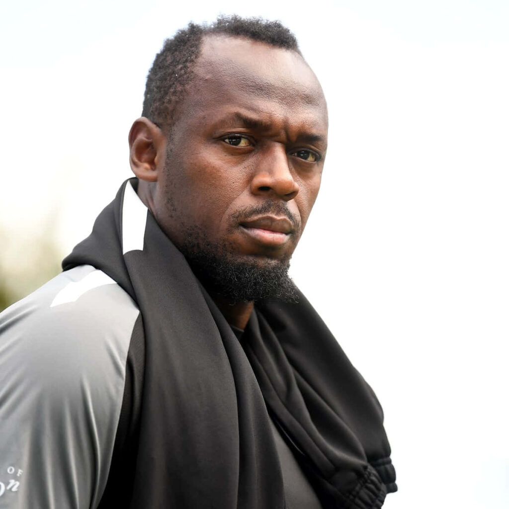 Usain Bolt serious intense focused expression high resolution wallpaper background image