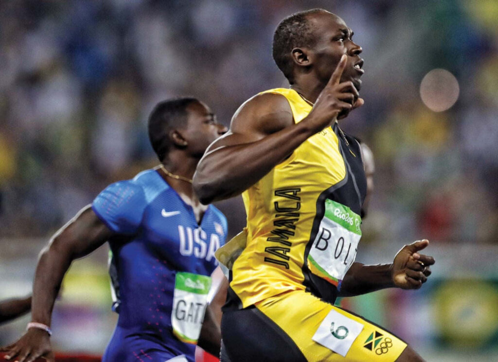 Usain Bolt sprinting powerfully ahead showcasing speed determination dynamic race wallpaper