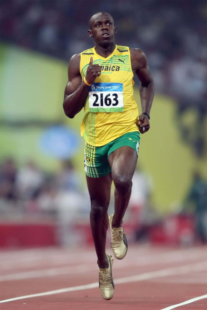 Usain Bolt sprinting on track showing speed and determination dynamic sports wallpaper