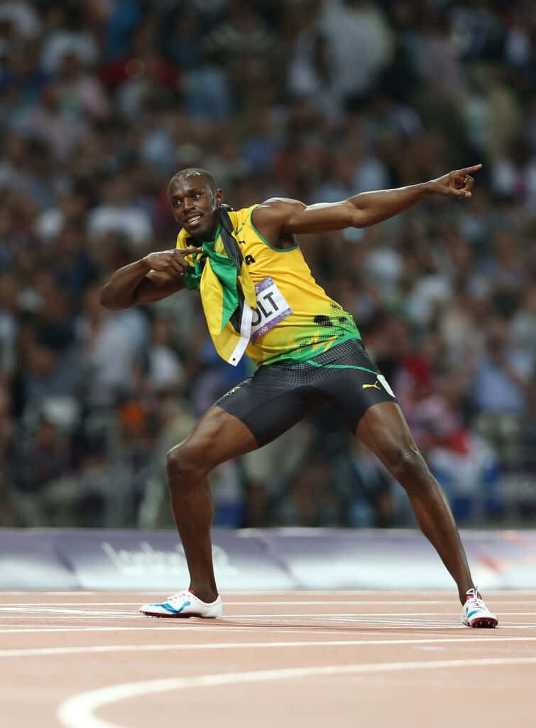 Usain Bolt in iconic victory pose on track with cheering crowd capturing legendary athletics moment Wallpaper