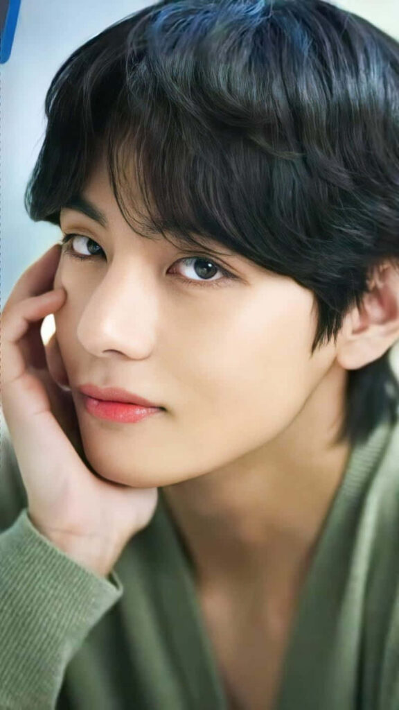 Close-up of BTS V with charming expression and flawless features phone wallpaper background