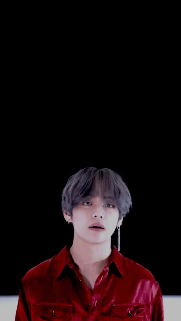 V from BTS in red shirt on black background phone wallpaper for BTS fans and Kpop lovers