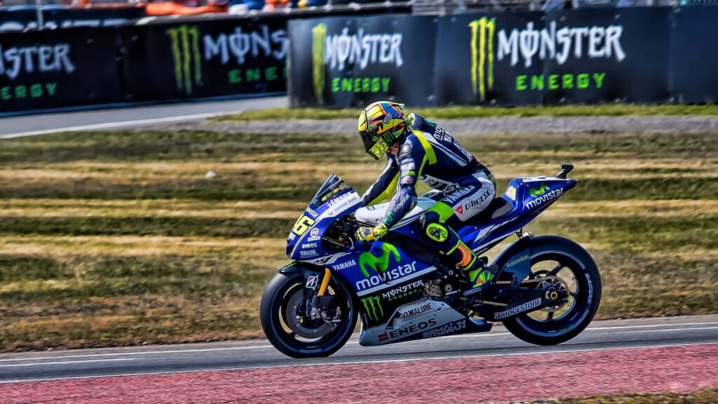Dynamic VR46 Yamaha MotoGP Racing Wallpaper with Bold Branding