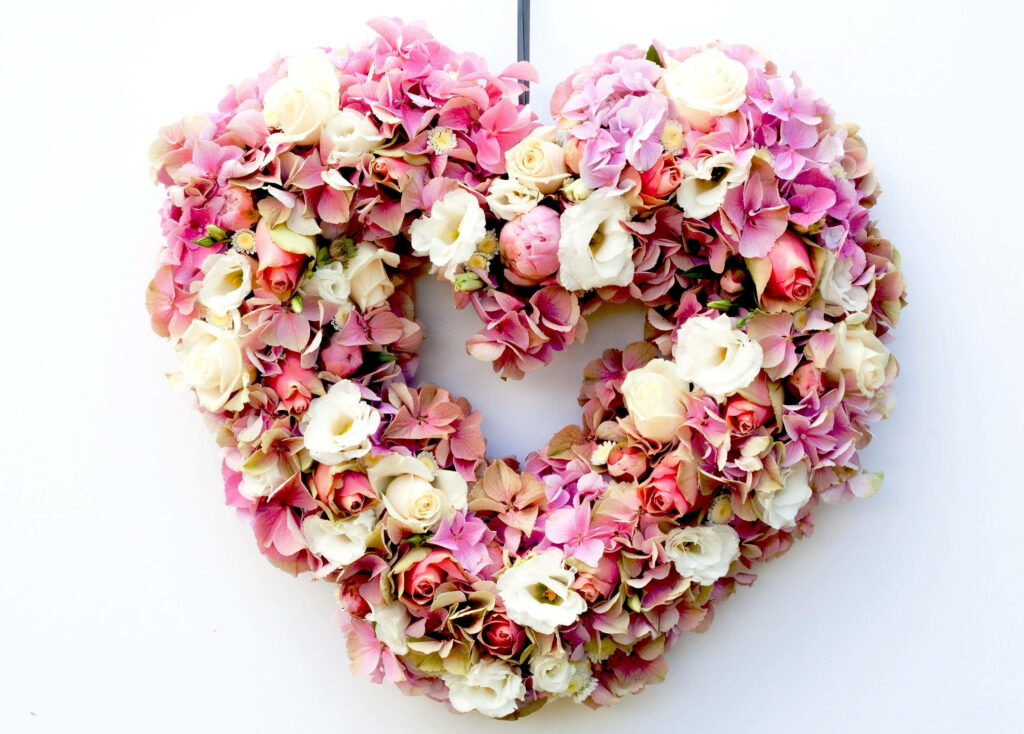 Valentine’s Day Wallpaper: Heart-Shaped Pink & White Flower Background