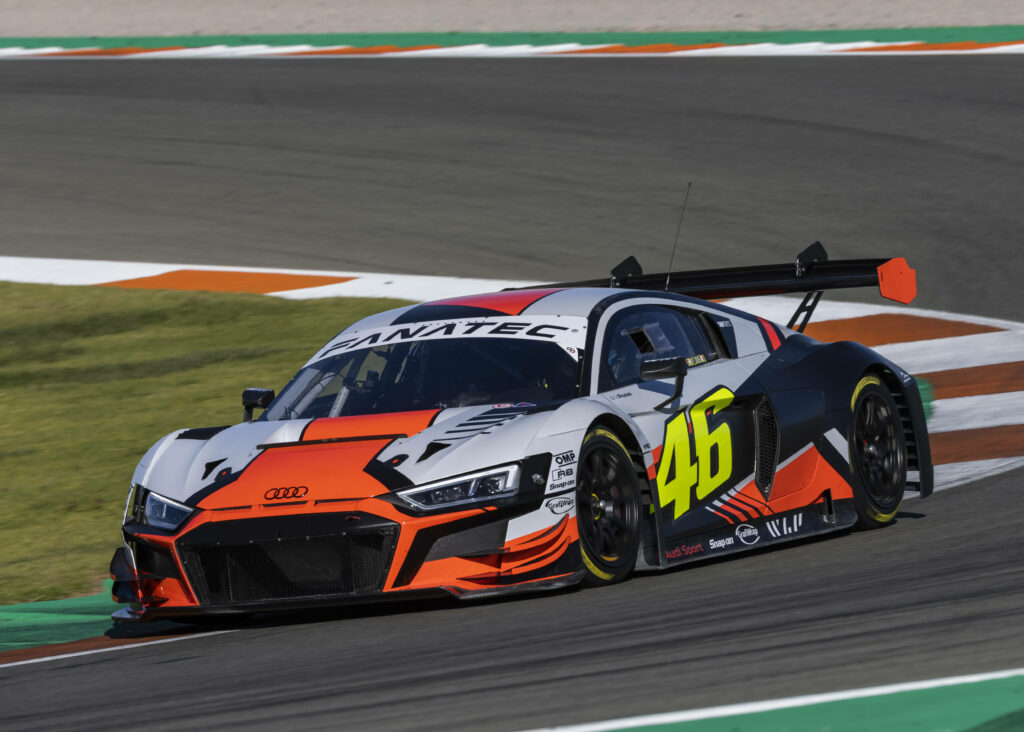 Valentino Rossi Audi R8 LMS GT3 racing car number 46 speeding on track with bold livery wallpaper