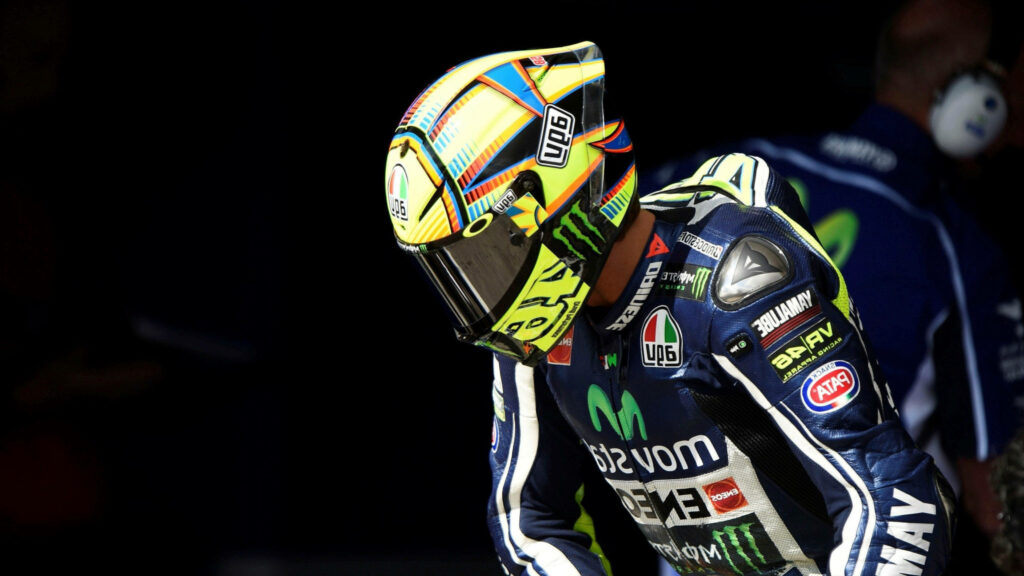 Valentino Rossi Wallpaper: Dynamic MotoGP Design with Monster Energy Helmet