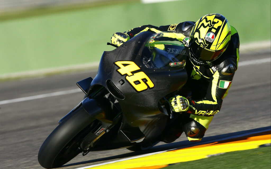Valentino Rossi Racing Wallpaper: Thrilling Moment at Valencia Circuit