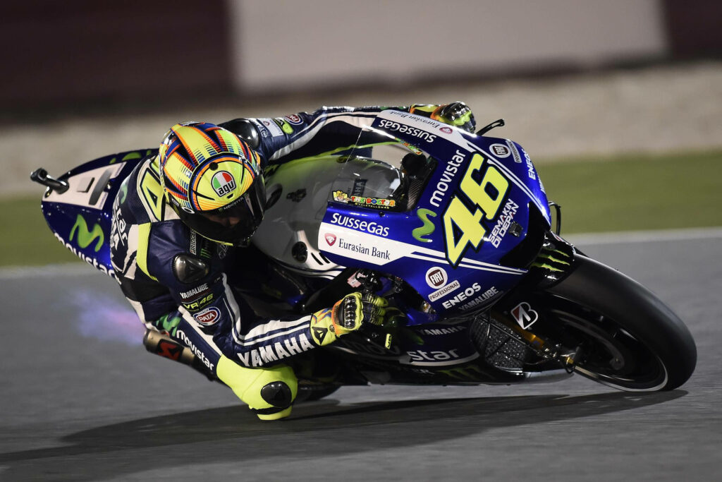 Valentino Rossi Wallpaper: Legendary MotoGP Racer in Sharp Turn