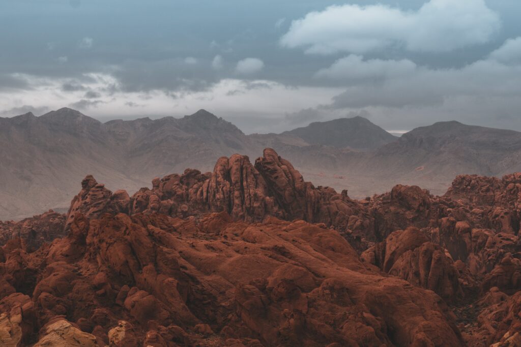 Red sandstone formations Valley of Fire Nevada vibrant rocky textures rugged mountains sky Wallpaper