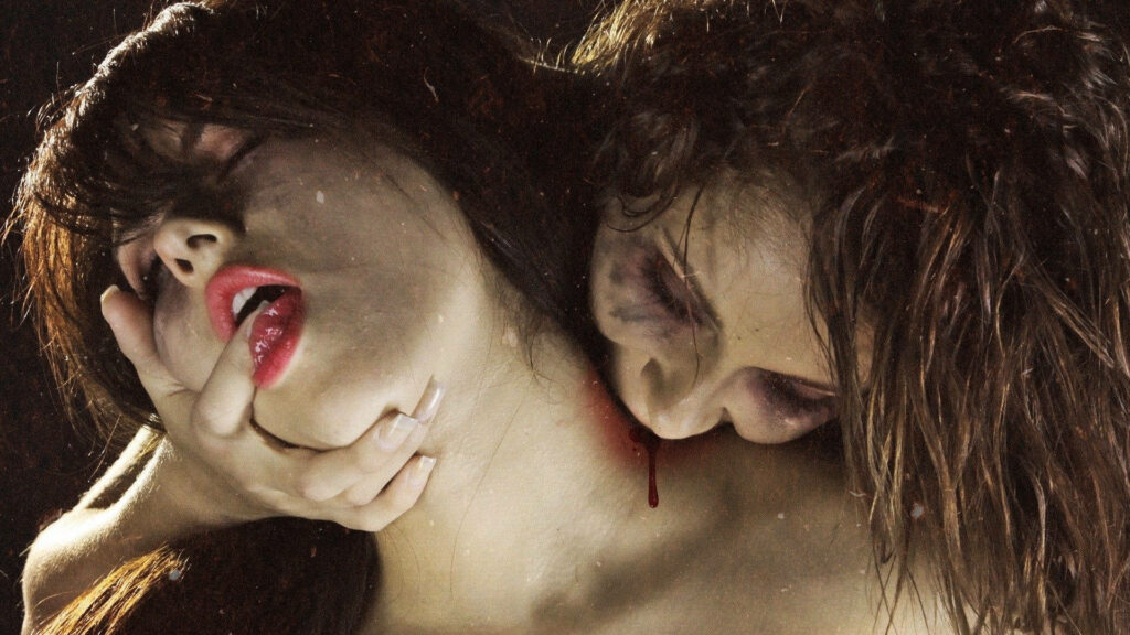 Dark vampire wallpaper showing a passionate bite marking a woman as eternal partner emotion
