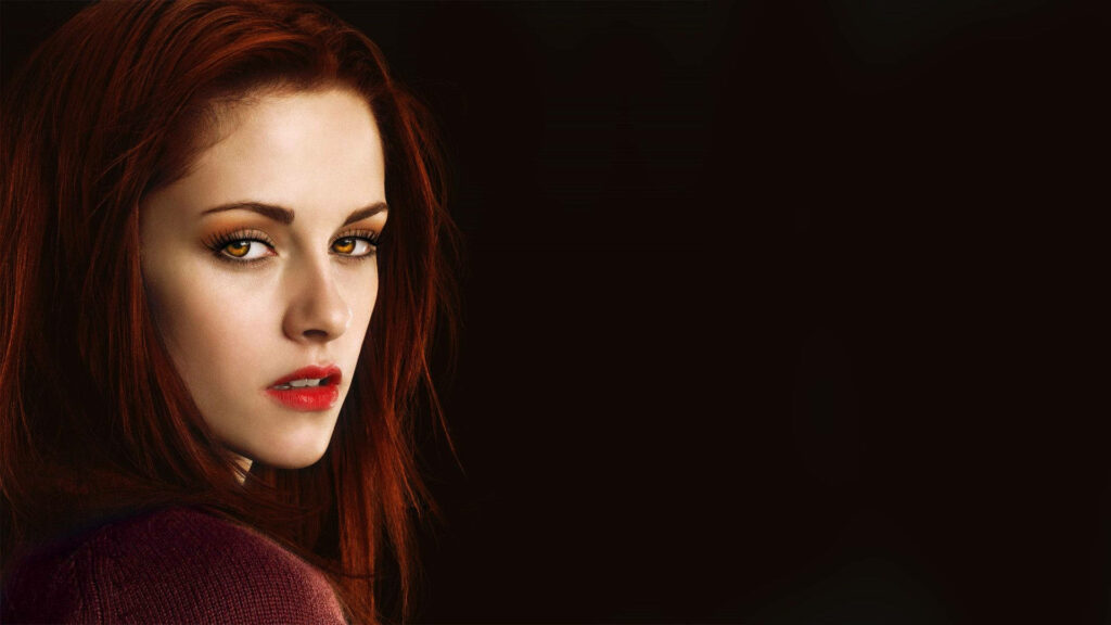 Mysterious woman with golden eyes and red lips in dark moody vampire romance wallpaper background