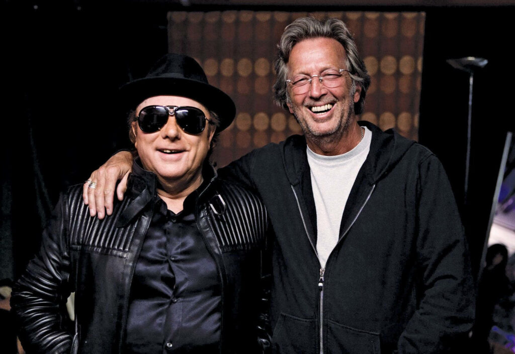 Van Morrison and Eric Clapton candid moment stylish leather jacket sunglasses iconic music wallpaper