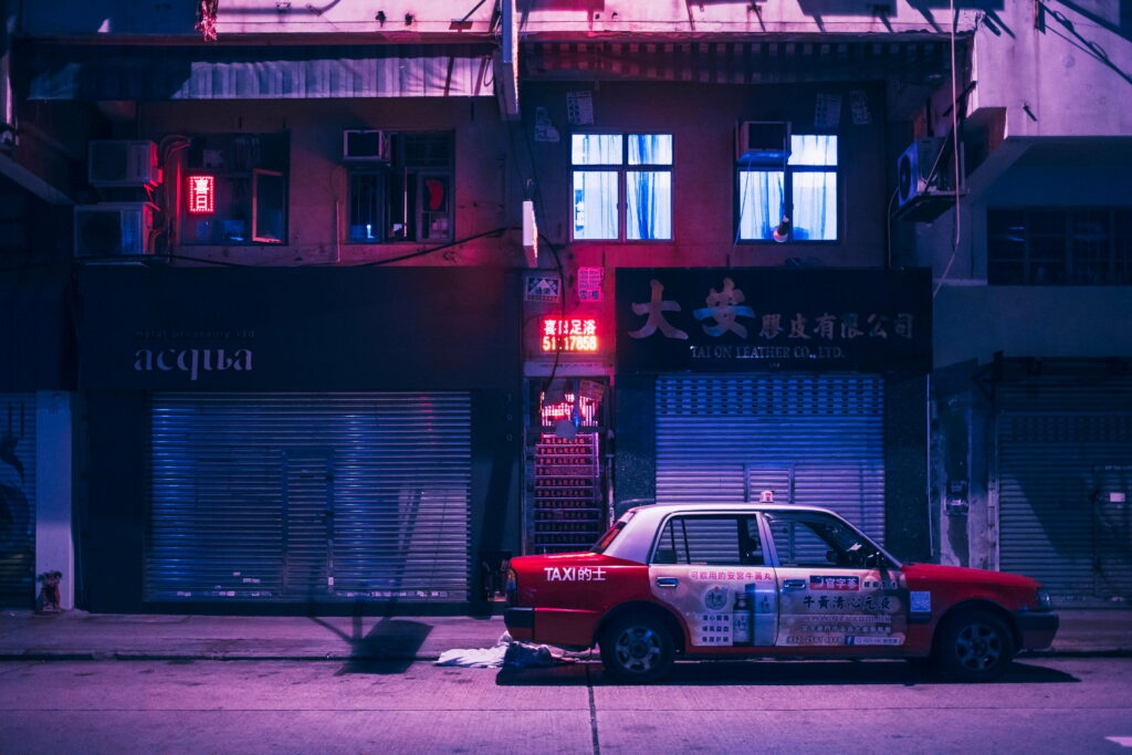 A Neon Vaporwave Wallpaper Featuring a White and Red Sedan in Hong Kong, China
