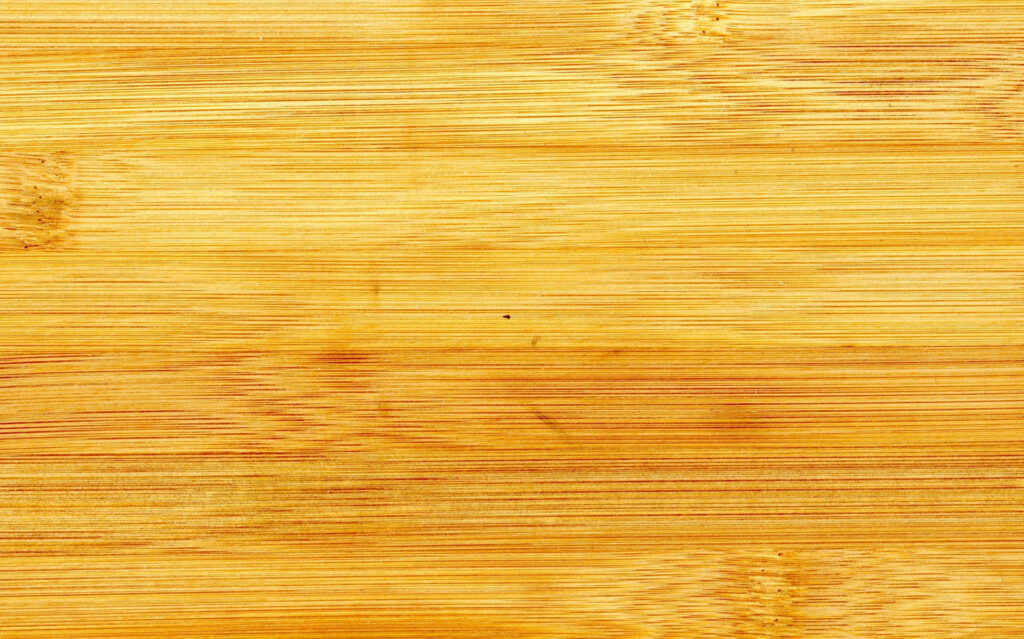Elegant bamboo wood texture wallpaper with warm golden hues and smooth horizontal grain lines