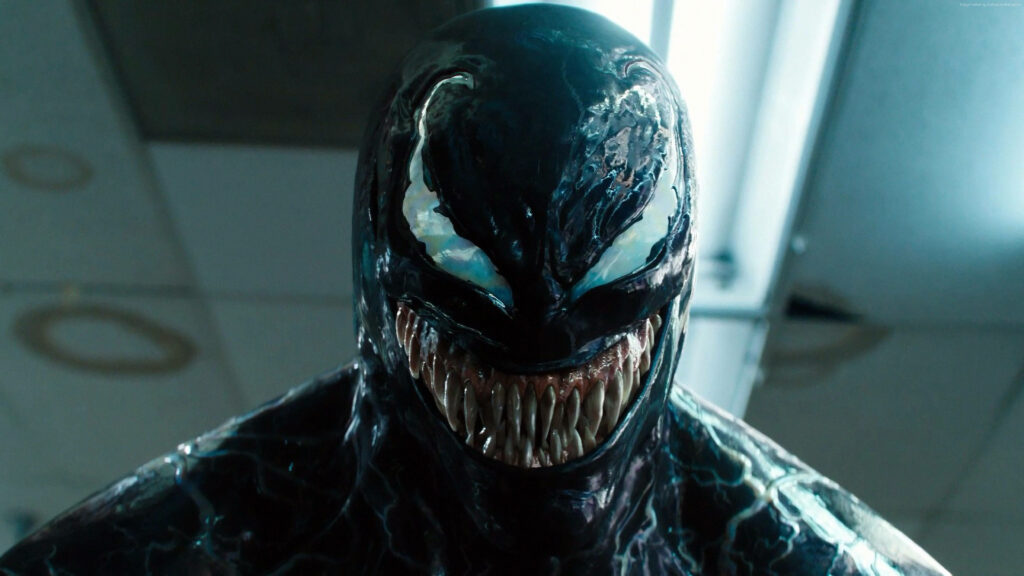 Fierce Venom Movie Wallpaper: Intimidating Grinning Character