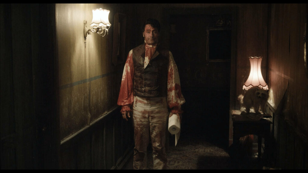 Viago in Bloody Hallway: Dark Comedy Wallpaper from What We Do in the Shadows