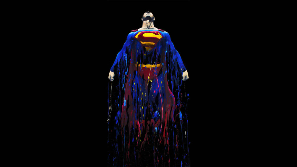 Vibrant 1440p Superman AMOLED Wallpaper: Artistic Color Splash Design
