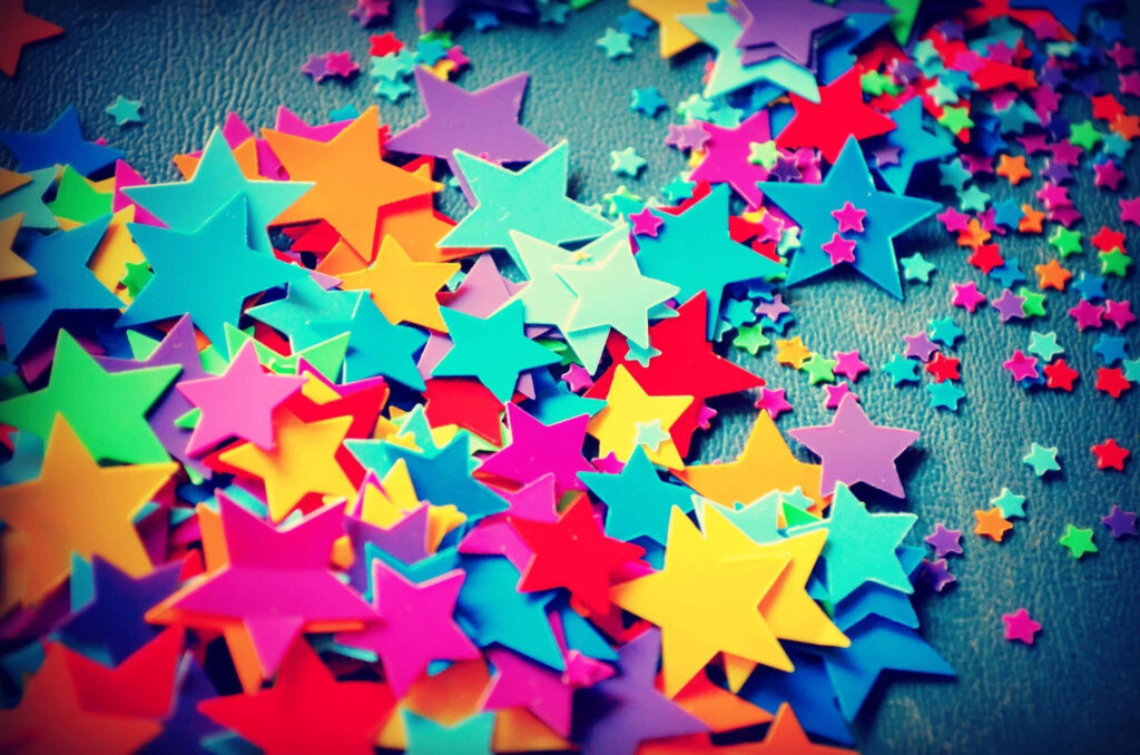 Vibrant 3D Star Wallpaper: Colorful Playful Background Design