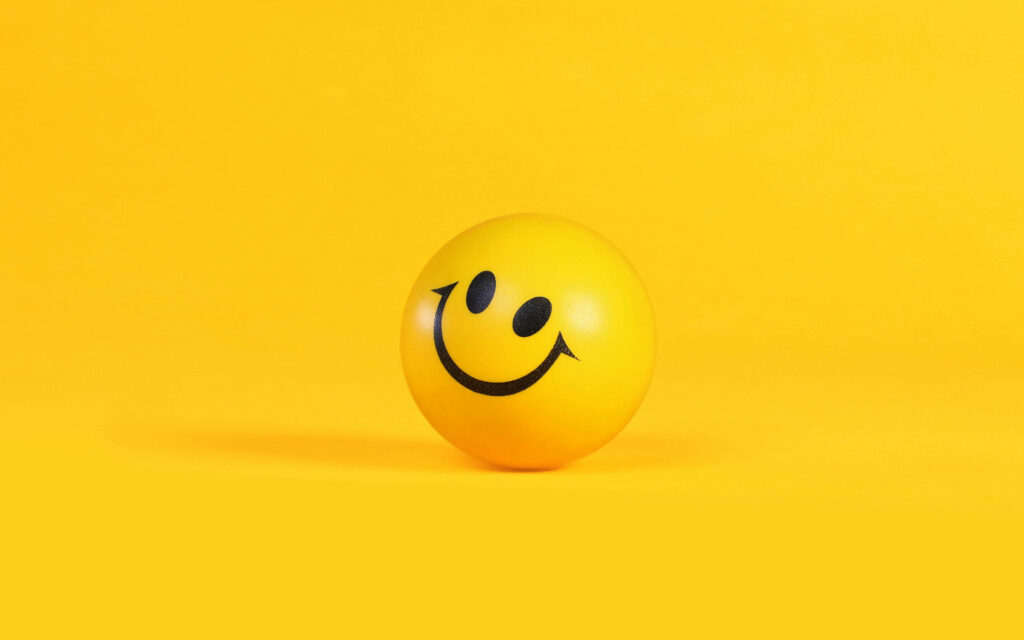 Cheerful Yellow Smiley Ball 3D Wallpaper for Bright Android Screens