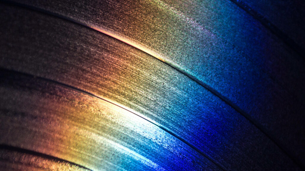 Vibrant 4D Ultra HD Wallpaper: Metallic Textures in Sunrise Colors