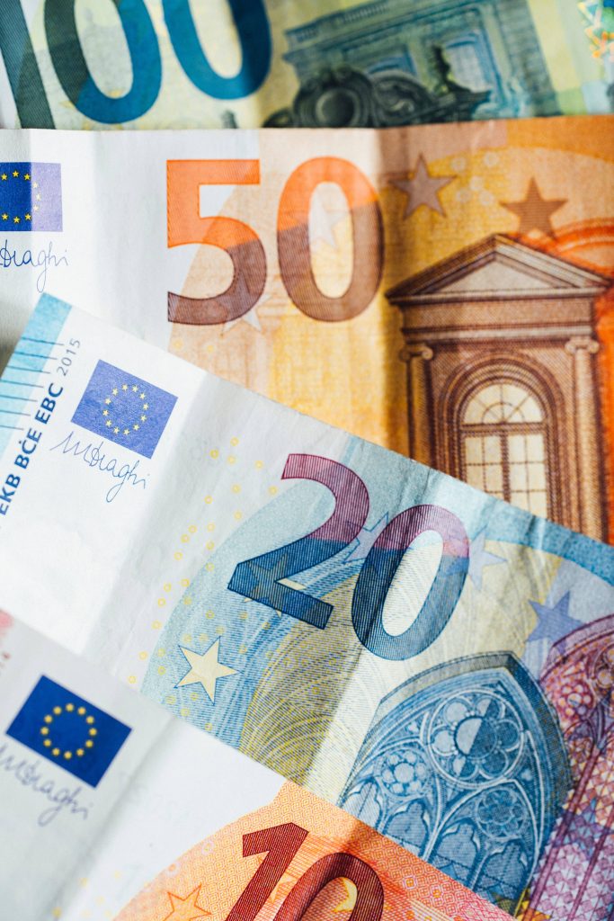 Vibrant 4K close-up of layered 10 20 50 100 Euro banknotes colorful money wallpaper background