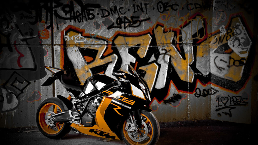 Vibrant 4K KTM Motorcycle Wallpaper with Graffiti Background