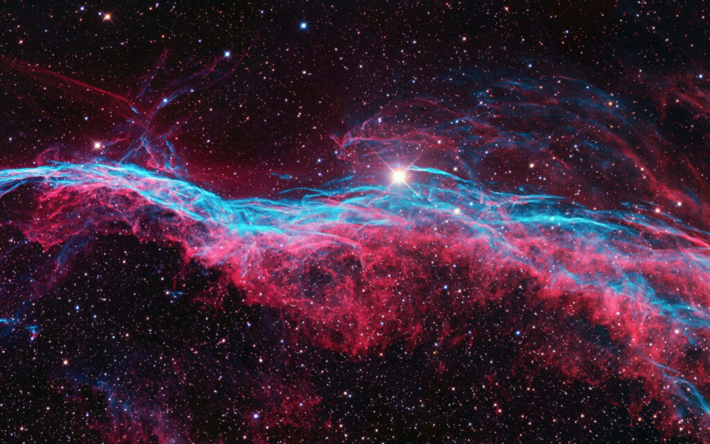 Vibrant 4K space wallpaper of red and blue nebulae amidst a starry celestial backdrop.