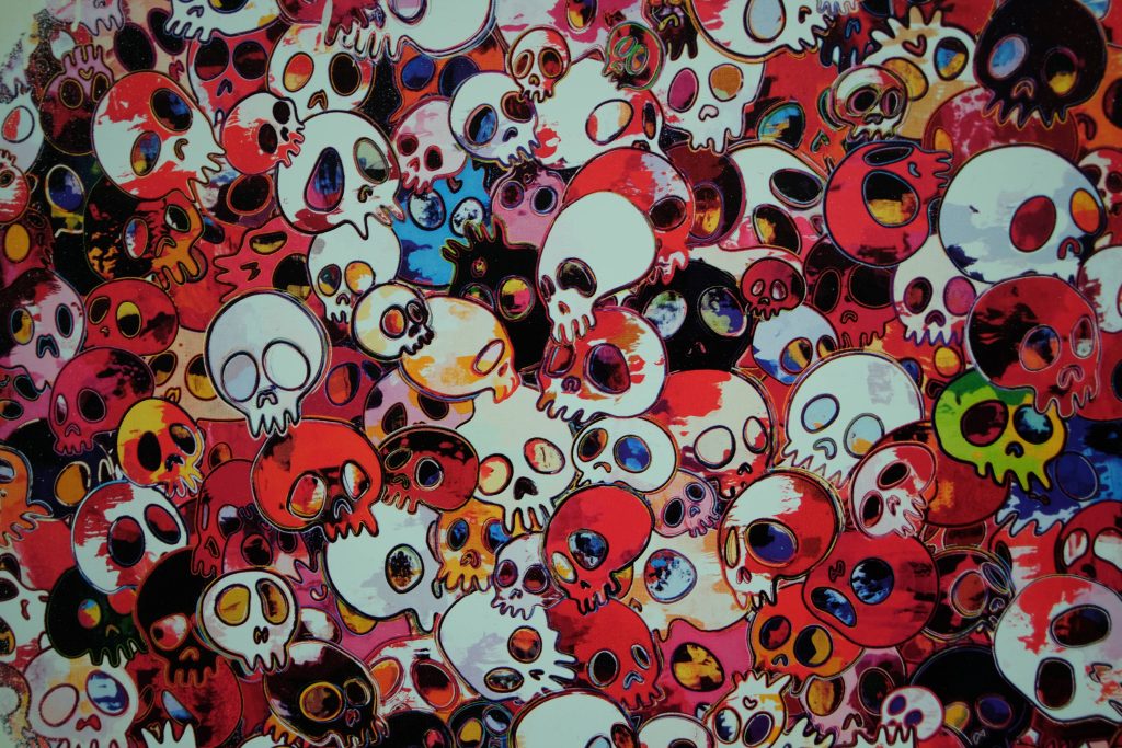 Vibrant 4K Takashi Murakami style skull wallpaper bold red orange white chaotic pattern