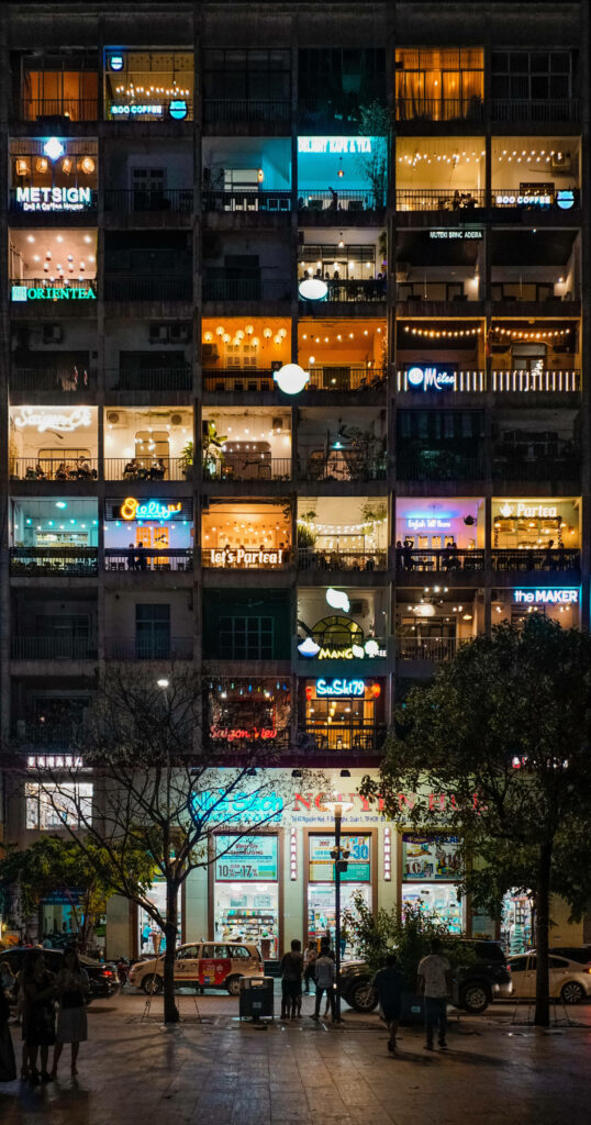 Vibrant 4K HD Wallpaper: Illuminated Condominiums at Night