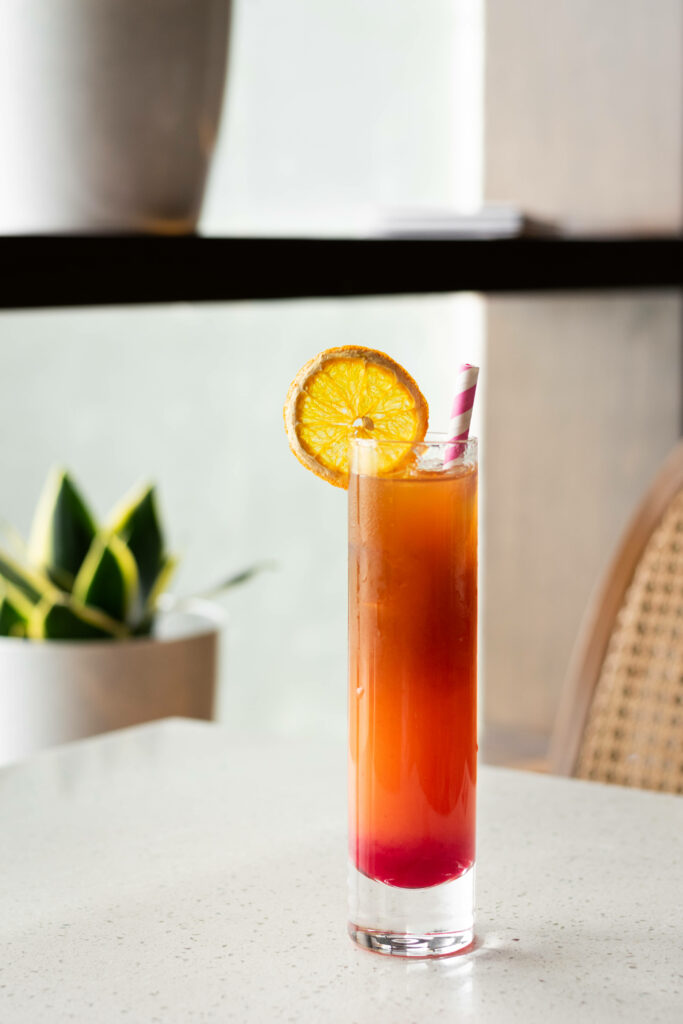 Vibrant 4K Wallpaper: Refreshing Orange Mocktail on White Tabletop