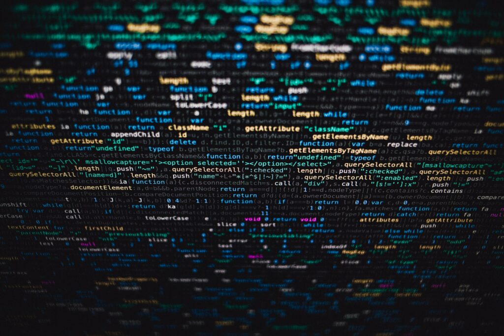 Vibrant Blurred Code Wallpaper - Dynamic Tech-Inspired Background