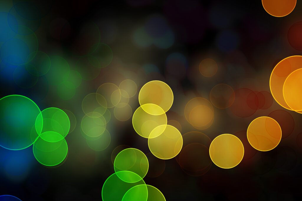 Vibrant Colorful Circle Bokeh Wallpaper on Dark Background