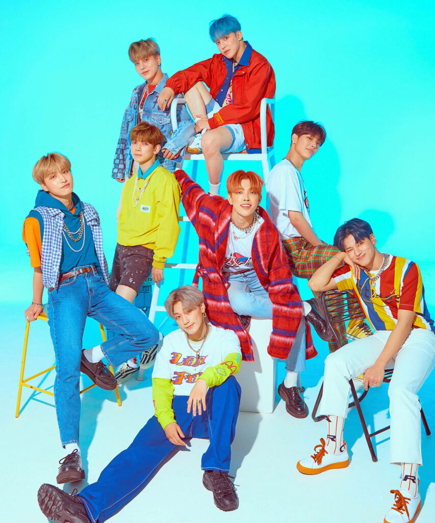 Vibrant ATEEZ Wallpaper: Youthful Energy on Bright Blue Background