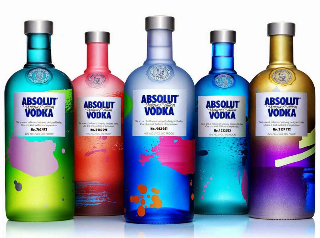 Vibrant Absolut Vodka Unique Edition bottles with colorful artistic patterns wallpaper background