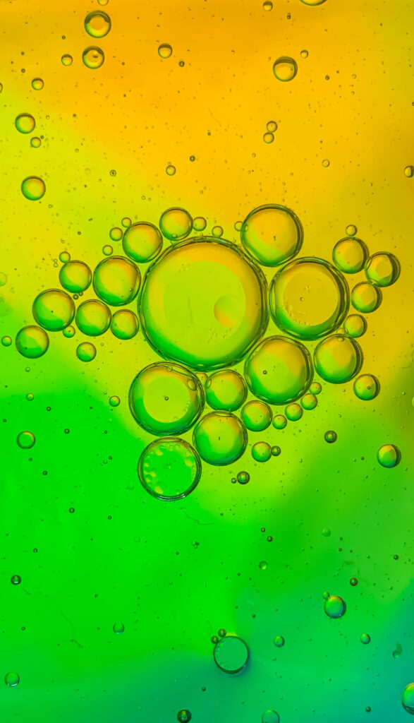 Dynamic Green and Yellow Abstract Bubble Wallpaper Background