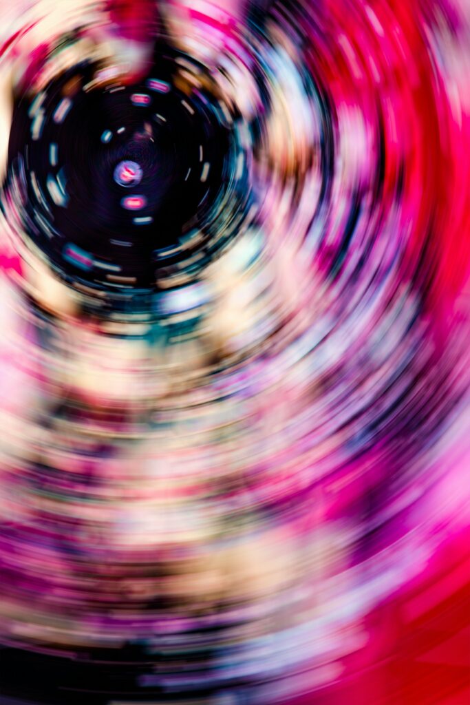 Vibrant Abstract Circular Motion Background with Energetic Colors Wallpaper