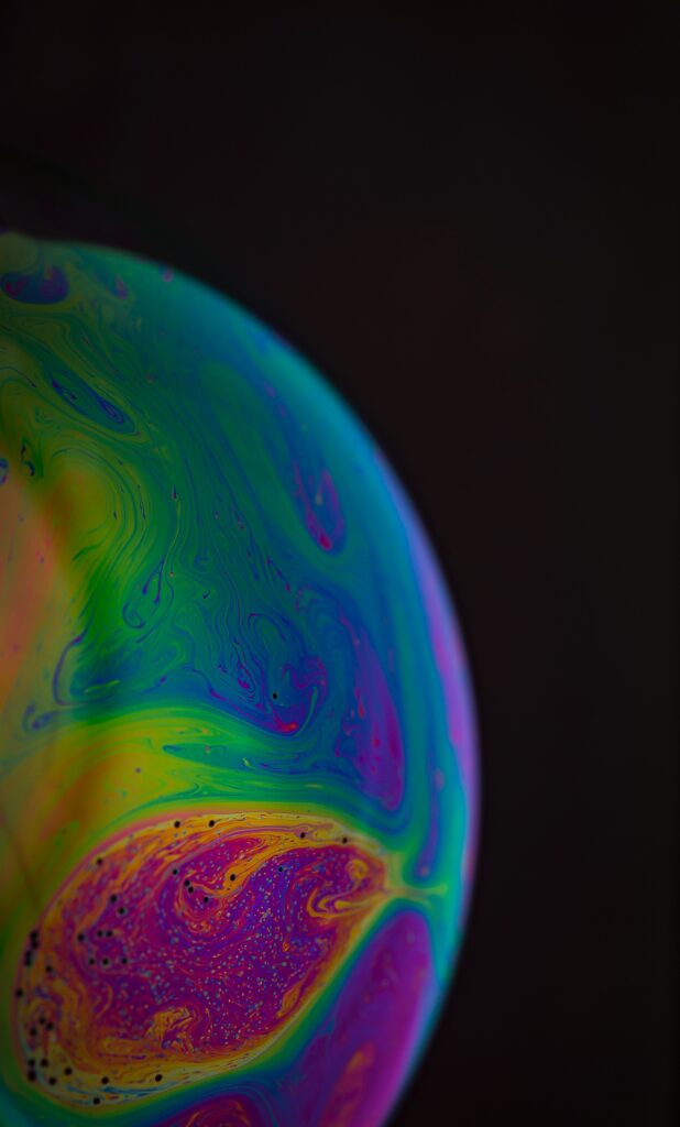 Mesmerizing Fluid Art Wallpaper: Vibrant Swirls on Dark Background